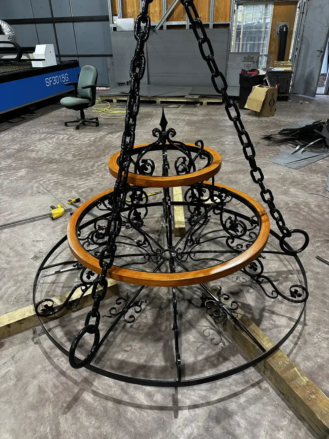 Scrollwork and chain on the chandelier