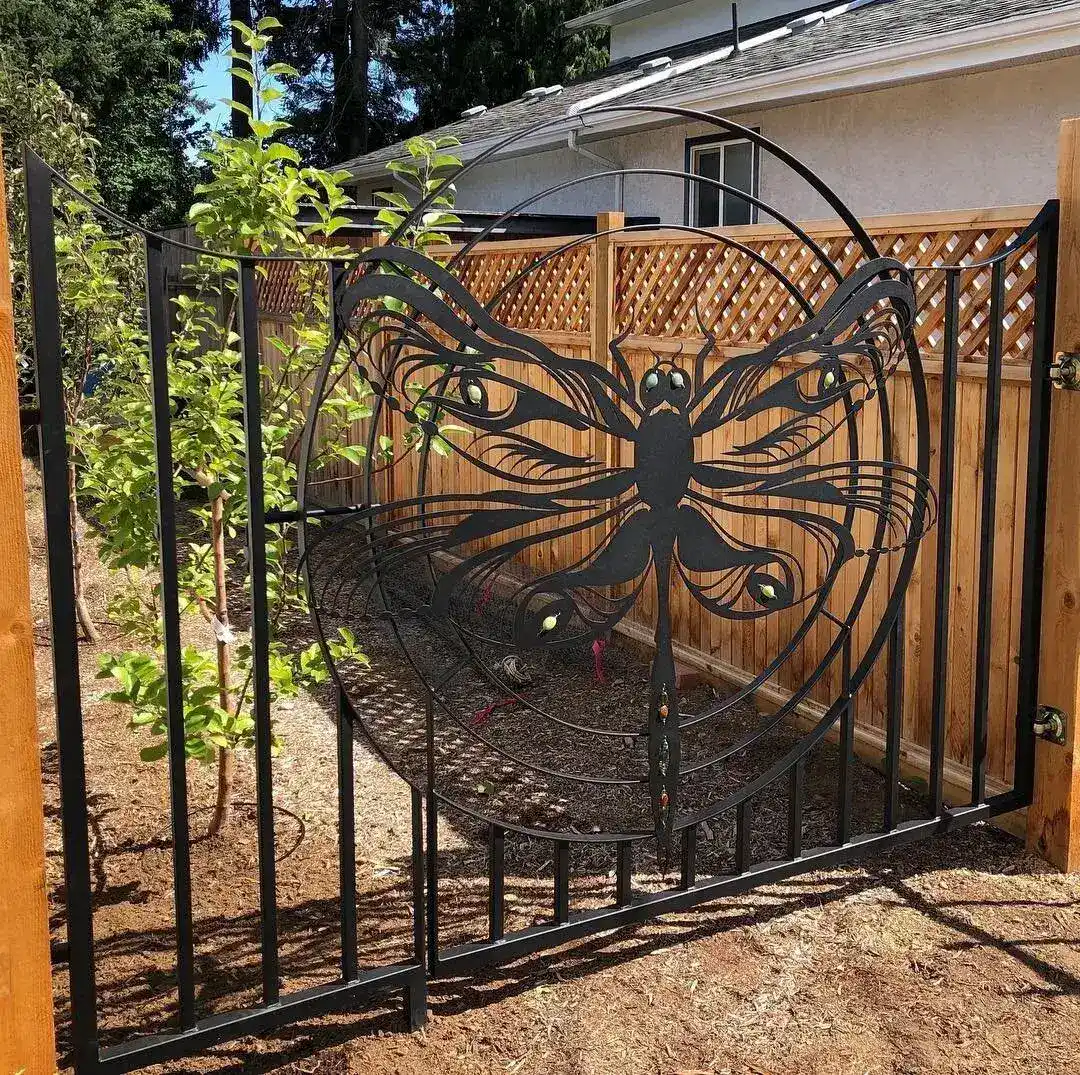 The Dragonfly Gate installed in a cedar fence