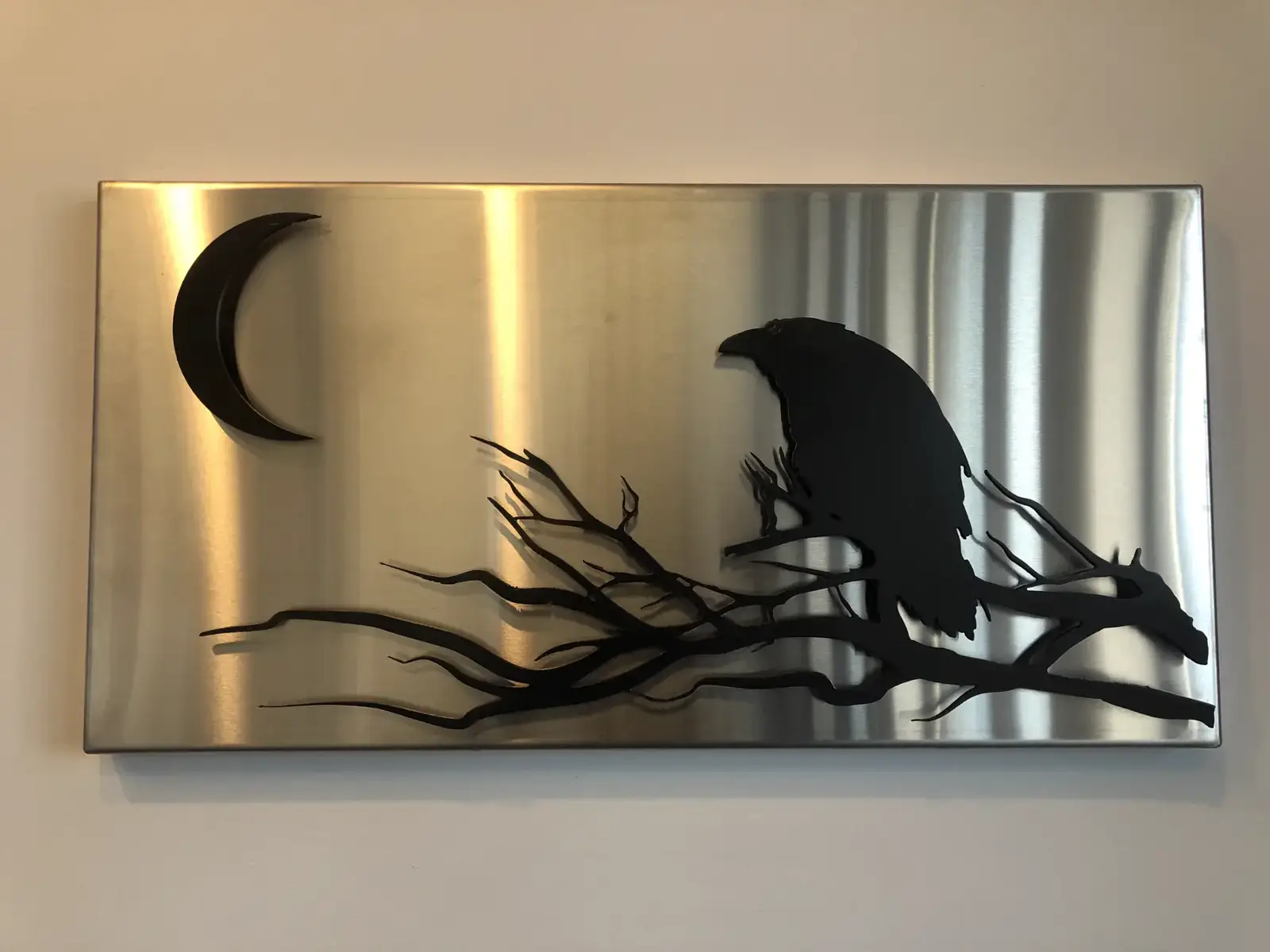 Raven and moon, brushed stainless